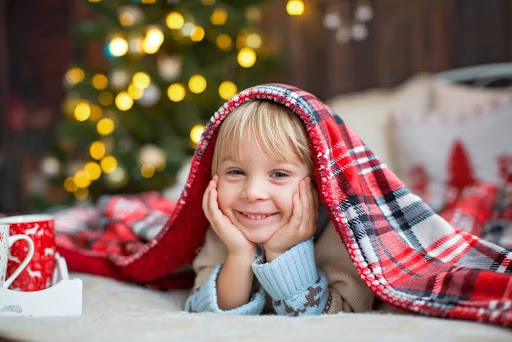 Little boy in a Christmas cabin