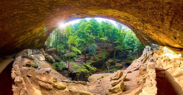 A picture of a Hocking Hills cave, one of the best destinations for spring travel