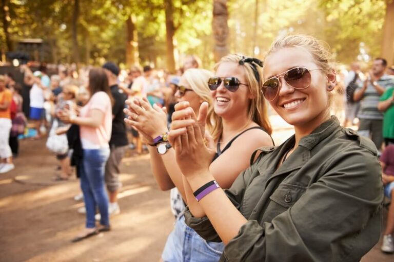 Plan Your Trip Around the Best Annual Hocking Hills Events: A group of people clapping outside